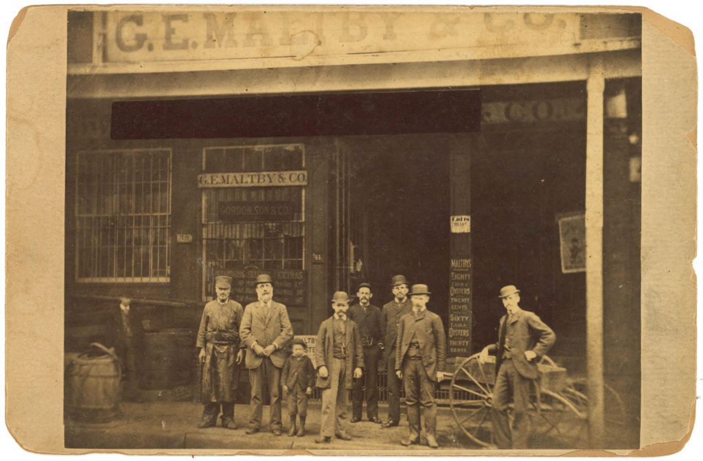 Employees of G.E. Maltby & Co. standing in front of 39-41 Harrison Street, ca. 1885