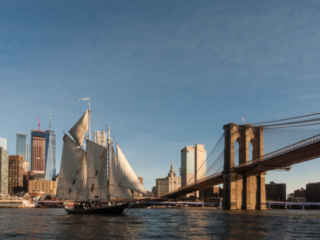 Historic schooner Pioneer sails past the Brooklyn Bridge