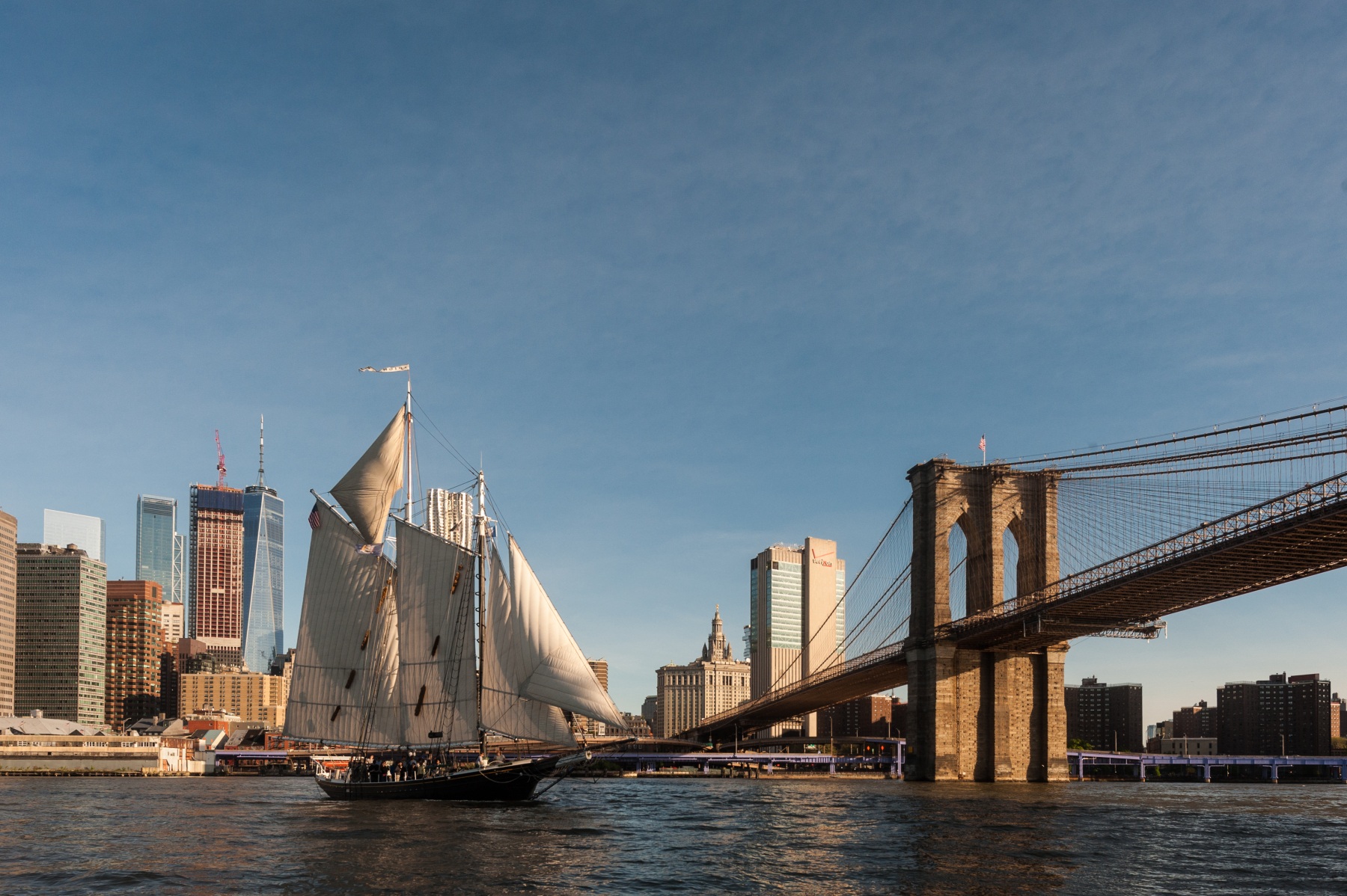 Historic schooner Pioneer sails past the Brooklyn Bridge