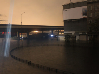 Evening photograph of the devastation of Hurricane Sandy on John and South Streers