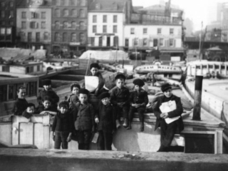 Canal boat children on a barge at Coenties Slip, ca. 18901915 from the Museum's Thomas W. Kennedy Collection