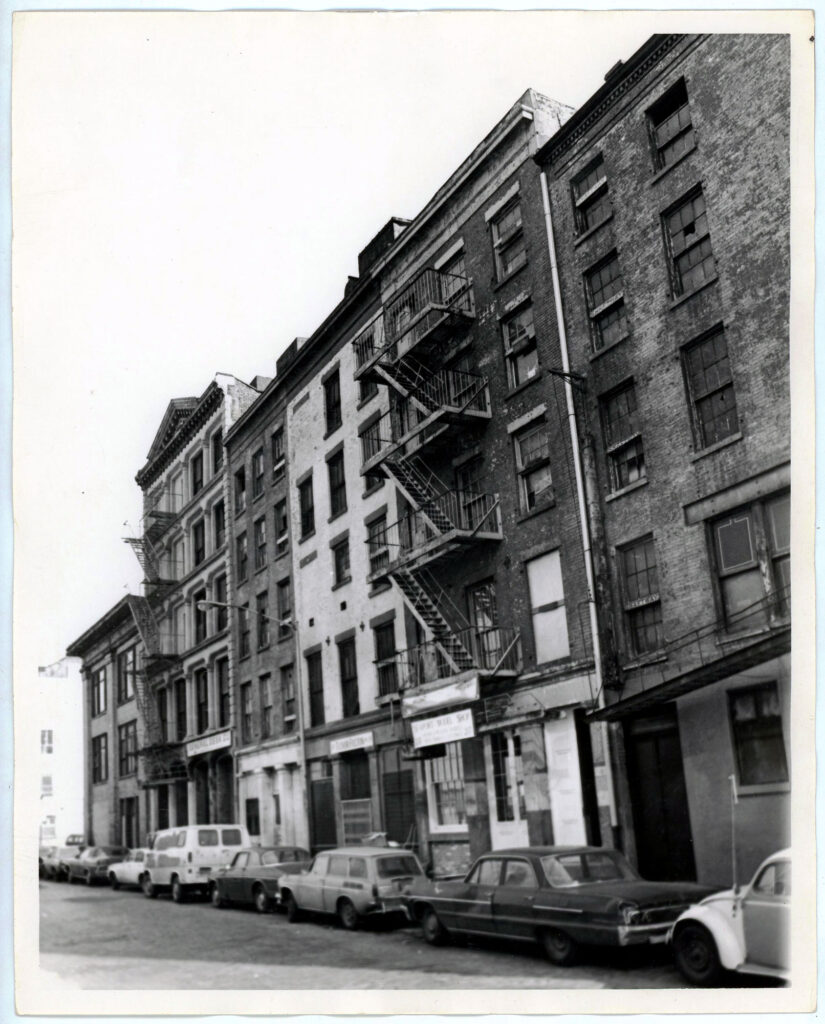 Little Water Street looking north, pre renovation. Parked Cars visible on the street