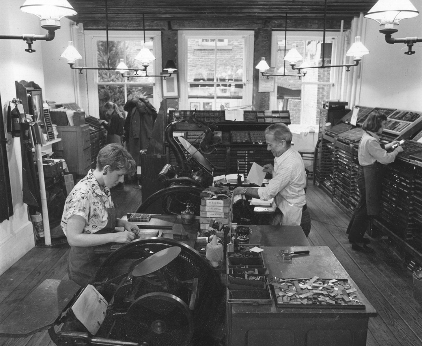 Letterpress printers and designers in the back room of Bowne & Co., Stationers, ca. 1985