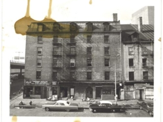 View of Schermerhorn Row pre-restoration, from the Market Building, ca. 1971
