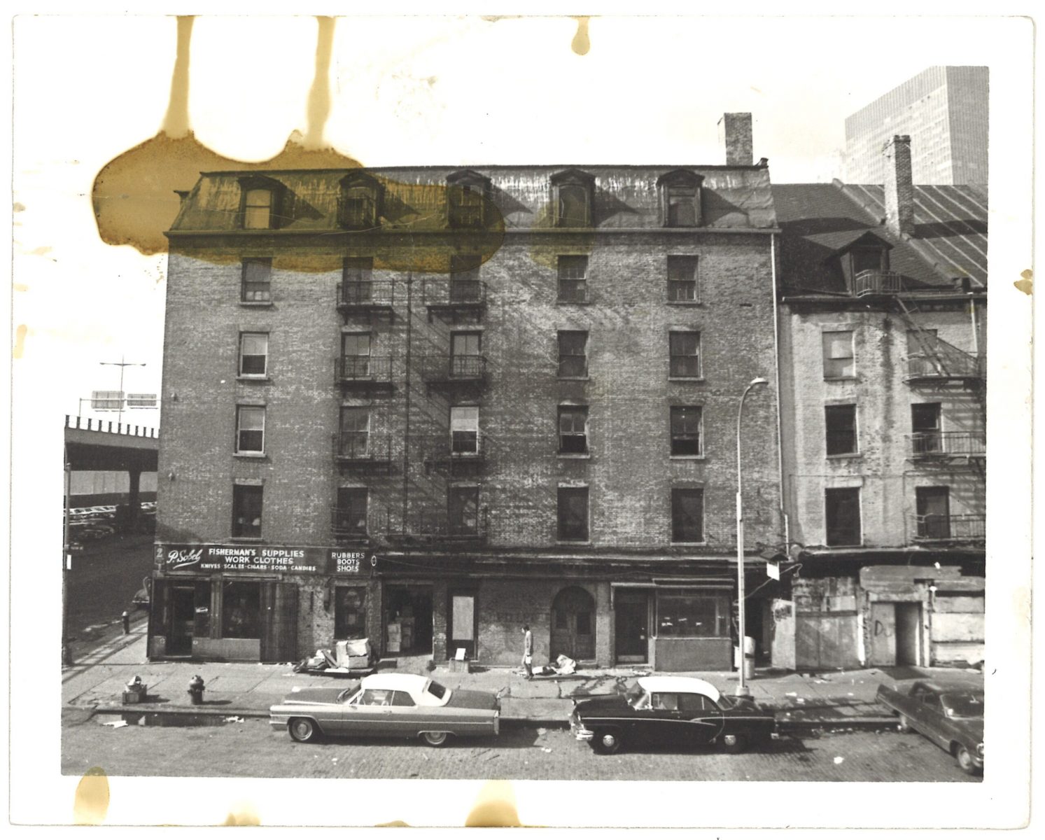 View of Schermerhorn Row pre-restoration, from the Market Building, ca. 1971