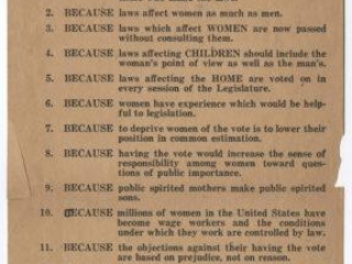 A brown piece of paper with printed black text reading &ldquo;12 Reasons why Women Should Vote&rdquo; followed by a list of 12 numbered points.